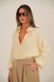 חולצת בלוז צהובה